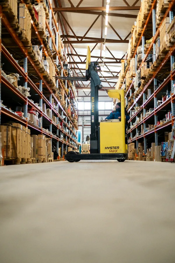 Representative forklift operating in a warehouse